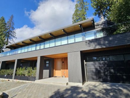 A modern home exterior painted by Goodwell Painting
