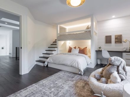 A bright painted bedroom with built-in loft bed