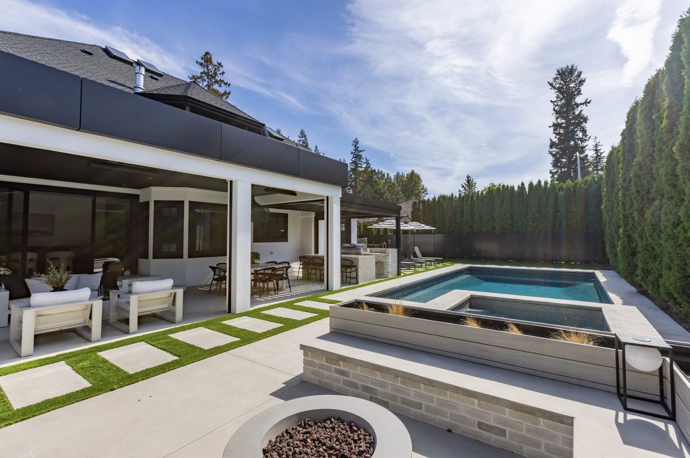 A home exterior with a pool in Tsawwassen