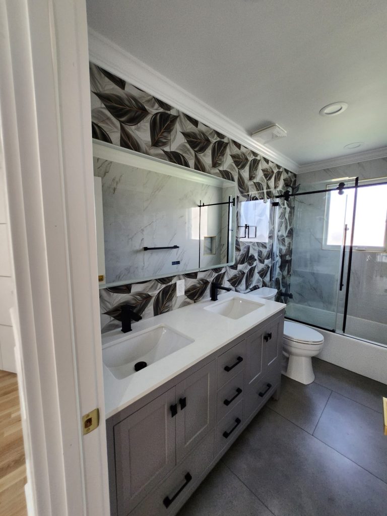 A bathroom vanity with a patterned feature wall